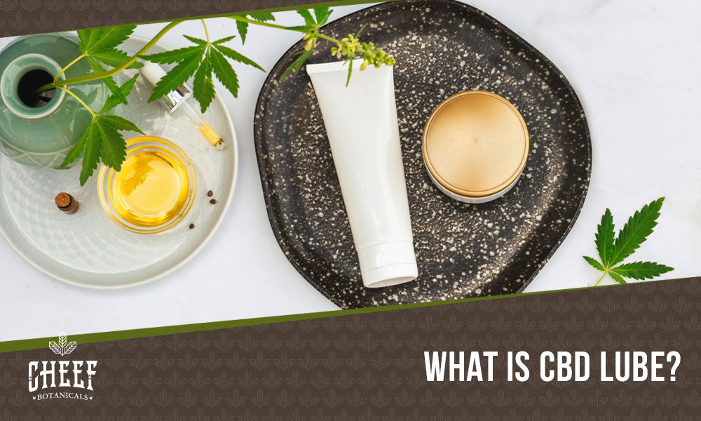 cbd lube (featured blog image by Cheef Botanicals) shows a bottle of CBD lube and other relaxation items on a plate