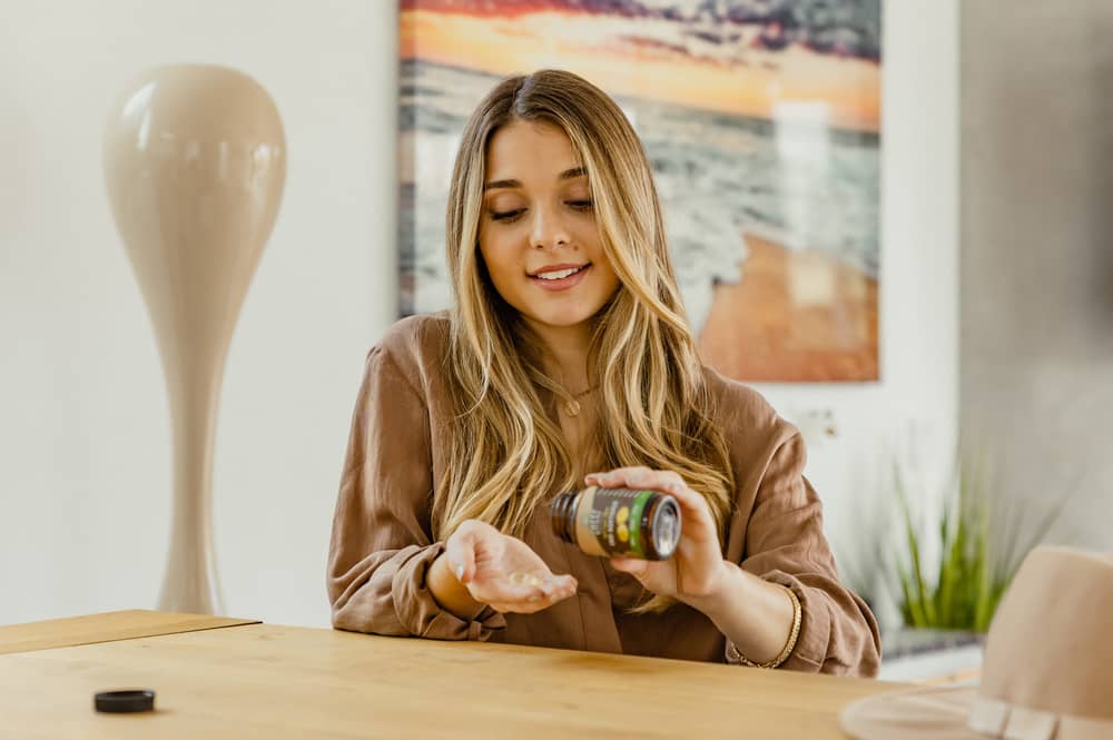 young woman enjoying vegan capsules