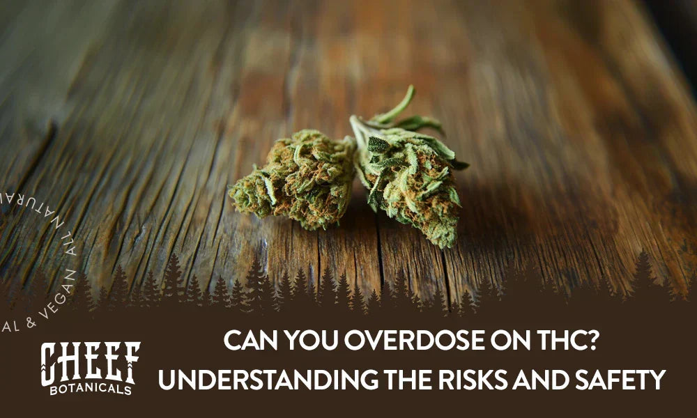 Two cannabis buds sitting on a wooden table.